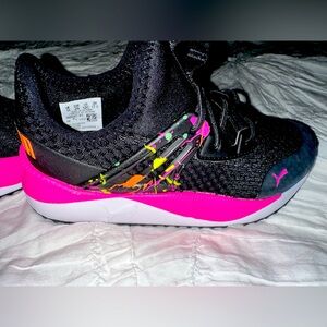 Brand new girls Puma black sneakers with pink accent. US size 12 C.